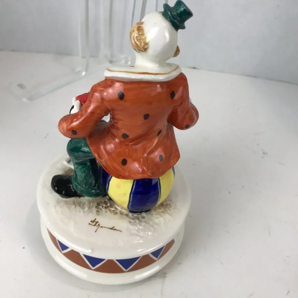 Hand painted ceramic clown music box signed by the artist